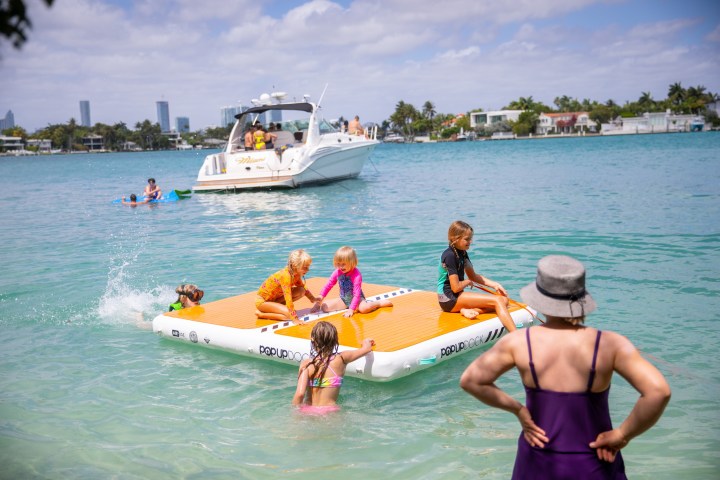 a group of people in a boat on a body of water
