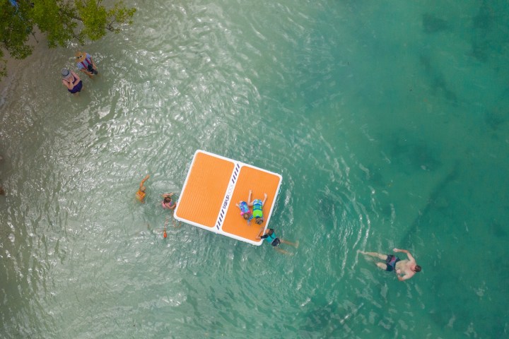 a group of people swimming in the water