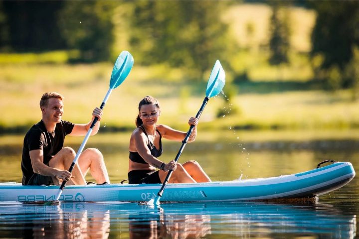 a group of people riding on the back of a boat