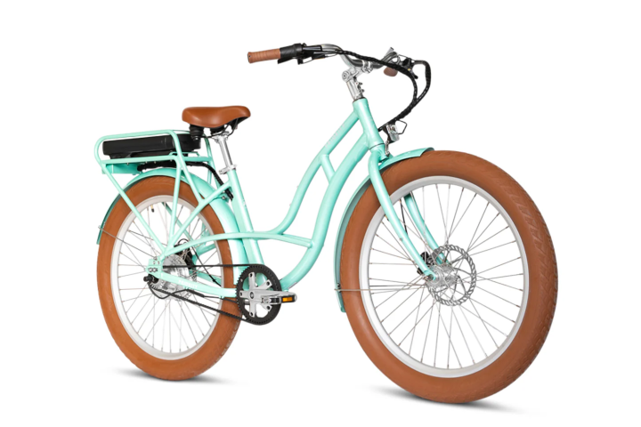 a bicycle leaning against a wall