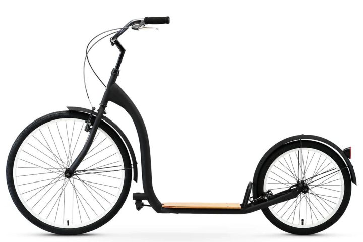 a bicycle leaning against a wall