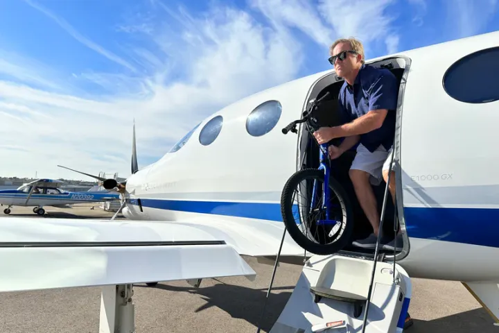 a man standing in front of a plane