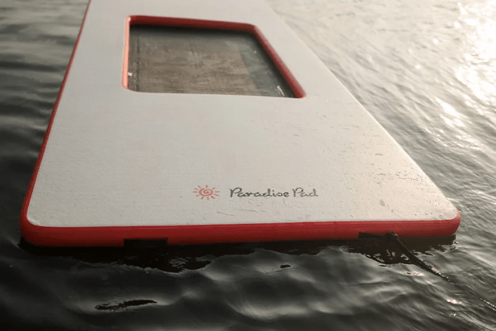 a close up of a boat next to a body of water